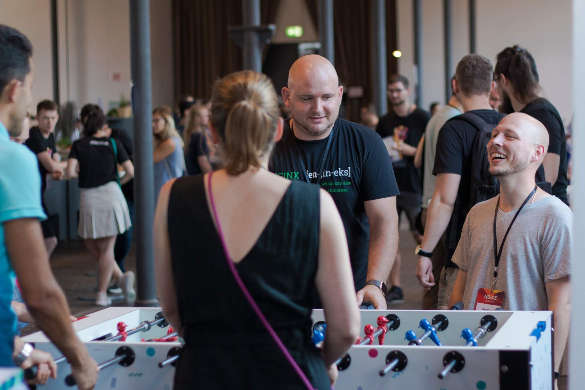 Attendees in the sponsoring area playing table soccer